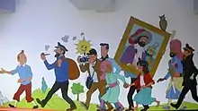 Personnages peints sur le mur d'une station de métro.