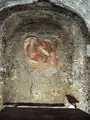 Vierge à l'Enfant juste né, fresque ayant donné son nom au lieu.
