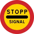 Arrêtez-vous au panneau si le signal est rouge