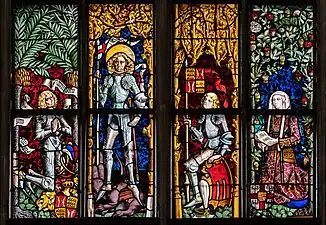 Partie inférieure d'un vitrail montrant le patron et fondateur de la Stiftskirche (Tübingen)&nbsp;(de). Ce vitrail a été réalisé par Peter Hemmel von Andlau vers 1578. Sur la gauche est représenté Eberhard V de Wurtemberg, fondateur de l'université de Tübingen, au milieu Georges de Lydda, le patron de l'église, l'identité du personnage suivant est incertaine, et à droite Barbara Gonzaga, première duchesse consort du Wurtenberg.