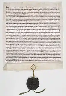 Manuscrit en vieux français, scellé du sceau de Henri III en cire verte sur cordonnets de soie rouge et verte.