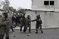 Gendarmes mobiles et Marines américains lors d'un exercice à Saint-Astier en décembre 2014.
