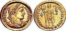 Médaille présentant sur une face un profil d'homme pourvu d'un diadème et sur l'autre face un homme debout tenant un étendard et une statuette de Victoire