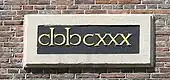 Exemple de ↀ composé à l’aide des symboles ‹&nbsp;clↄ&nbsp;› sur l'église Westerkerk construite en 1630 à Amsterdam.
