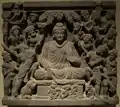 Les assauts de Mâra (les armées de Mâra). Relief sur schiste, 52,6&nbsp;×&nbsp;59&nbsp;cm. Gandhara, IIIe&nbsp;siècle. Musée d'art asiatique de Berlin Dahlem.